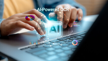 Close-up of hands using laptop with AI-powered OCR graphics, representing artificial intelligence for data extraction, document scanning, analytics, and digital automation.