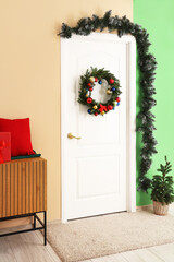 Interior of room with beautiful Christmas wreath