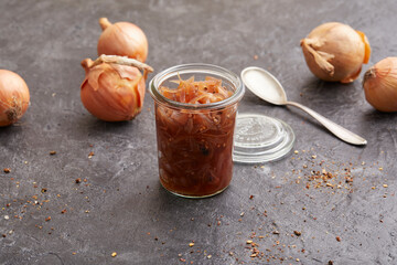 Balsamic pickled onions in a storage jar