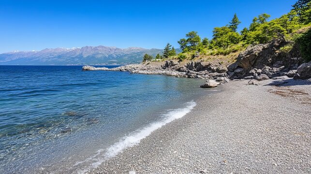 Serene pebble beach meets crystal-clear turquoise water under a vibrant blue sky, backed by lush greenery and distant mountains - Powered by Adobe