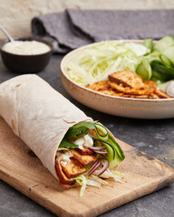 Tofu dürüm wrap with vegan yogurt sauce