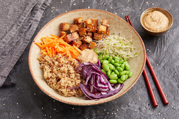 Quinoa edamame tofu bowl with red cabbage and carrots