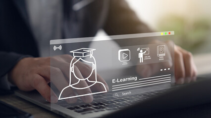 Businessman using laptop for e-learning, education, learning and online training with webinars and...