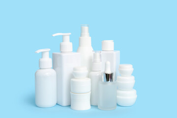 Different cosmetic products on blue  background