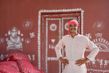 Fototapeta premium young indian asian farmer standing confidently at home