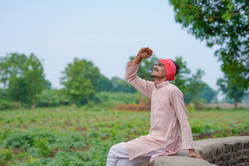 Indian farmer looking on sky and waiting for the rain