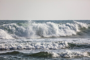 The ocean is calm and the waves are small