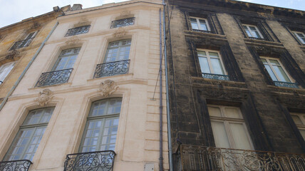 Obraz na płótnie Canvas comparison of wall building street facade before and after cleaning with real difference between cleaned and dirty house 