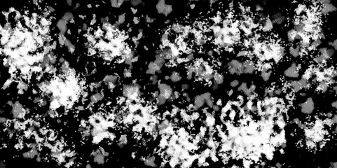 White snowflakes on a black background surface. Macro nature pattern backdrop. Snow overlay background isolated on black. Winter concept. scratches and cracks which can be used as a background.