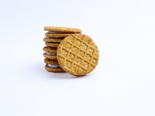 Stack of sandwich cookies with cream and blueberry filling on a white background