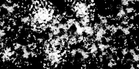 White snowflakes on a black background surface. Macro nature pattern backdrop. Snow overlay background isolated on black. Winter concept. scratches and cracks which can be used as a background.