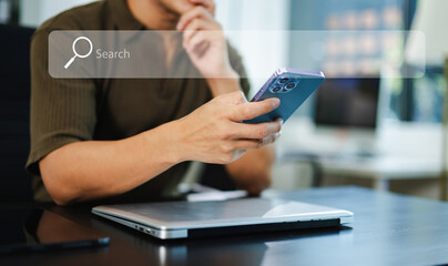 Fototapeta premium Searching Browsing Internet Data Information Networking Concept with blank search bar. man working with mobile phone