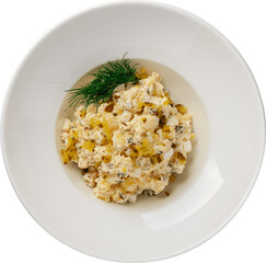 Delicious potato salad with pickles and egg, served in a white bowl, topped with dill.