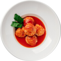 Meatballs in a rich tomato sauce, artfully garnished with fresh parsley.