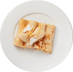 Rolled crepes with a rich, creamy filling, beautifully arranged on a white plate.