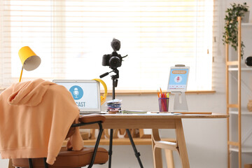 Podcaster's workplace with laptop and tablet computer in studio