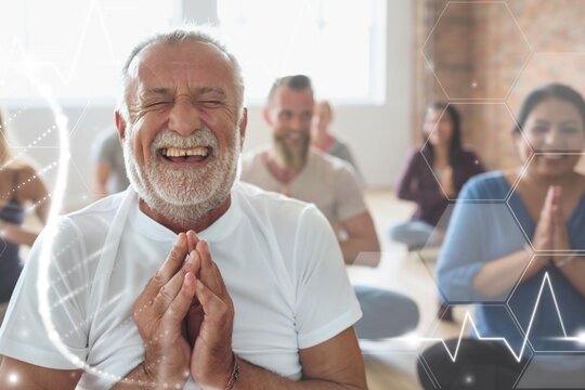 Smiling old man in yoga class
