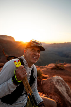 White male in his early 50s runs the Grand Canyon.
