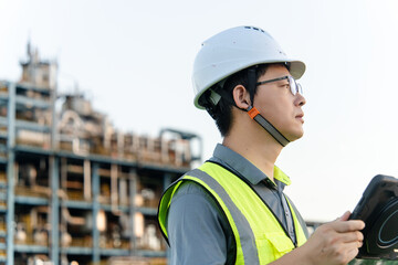 asian engineer working in oil refinery