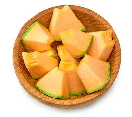 Sliced cantaloupe melon in wooden bowl isolated on white background. clipping path