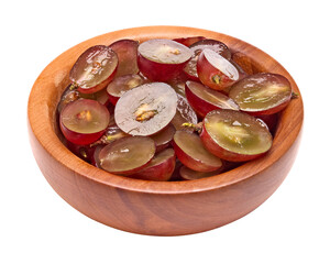 red grapes berries in wooden bowl isolated on white background. clipping path