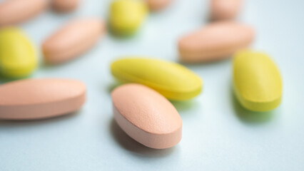 Colorful medicine pills tablet on blue background