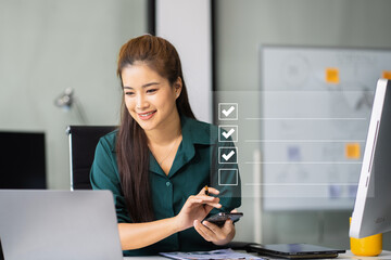 Businesswoman using tablet to do online checklist survey, doing assessment online survey answer...