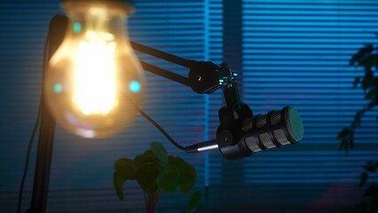 Podcast Recording Setup with Microphone and Lighting in Dark Room