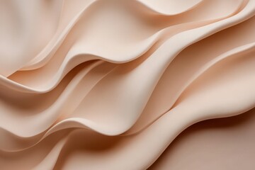 Obraz premium The image is a close up of a piece of fabric with a wave pattern. The fabric is a light pink color and he is made of a soft material.