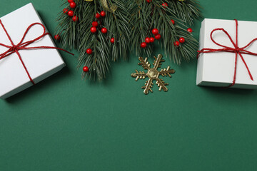 Bright Christmas decorations and gifts on classic green background