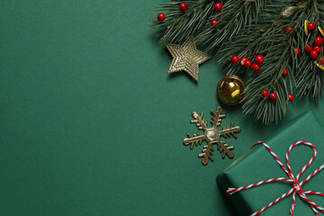 Bright Christmas decorations and gifts on classic green background