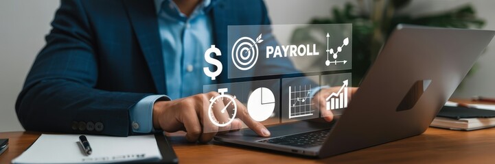 Businessperson working on payroll management on a laptop.