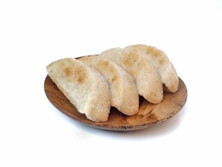 Pancong or Bandros cake is an Indonesian traditional snack made from a mixture of rice flour, grated coconut, and coconut milk.