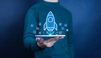 
Businessman touching transparent rocket icon launching. Startup concept, rocket, company growth,...