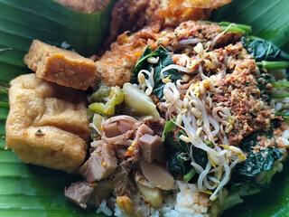 Nasi pecel or sego pecel is a typical Javanese Indonesian rice dish served with pecel sauce, which...