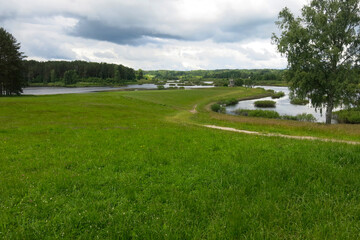 picturesque Russian summer expanses: fields, lakes, forest in Pushkin's Mikhailovskoye estate