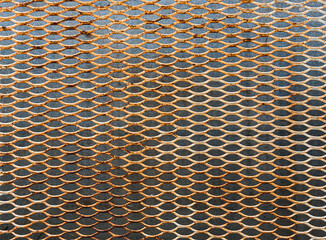 Top view of rusty steel grating floor