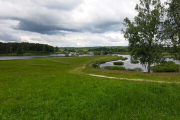 picturesque Russian summer expanses: fields, lakes, forest in Pushkin's Mikhailovskoye estate