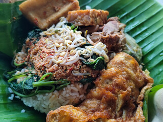 Nasi pecel or sego pecel is a typical Javanese Indonesian rice dish served with pecel sauce, which...