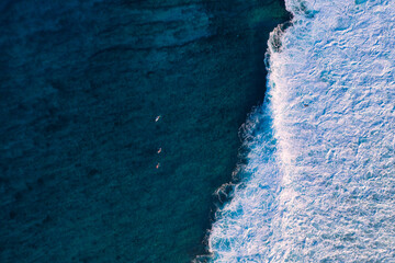 Aerial view of waves splashing in sea