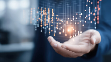 Data visualization floating above businessman's palm 