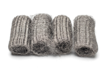 Steel wool, also known as iron wool or wire sponge. commonly used as an abrasive for cleaning, polishing, and surface preparation. isolated in white background.