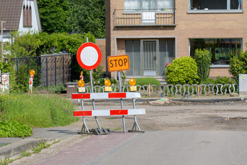 Temporary sign prohibiting the movement of vehicles during road repairs in a residential area