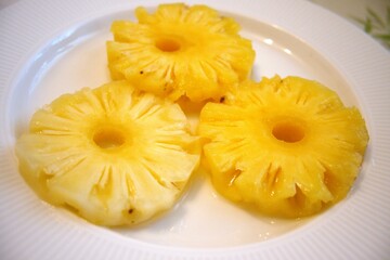 Pineapple rings on white plate
