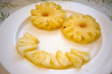Pineapple rings on white plate