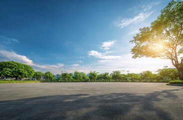 Fototapeta premium Empty asphalt floor and green garden park landscape background with blue sky and sunlight. Empty car stage for a sport, competition, or event on a summer day. Wide-angle lens, natural lighting. 