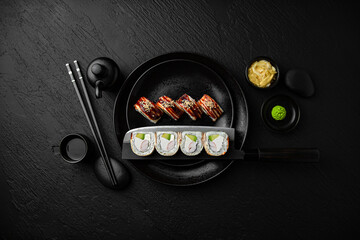 Panko roll with shrimp. Sushi composition on black background. The Art of Japanese Cuisine. Food photography for menu and sushi bar decoration