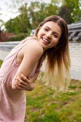 Sunlit smile on a carefree day in park, embracing summer vibes