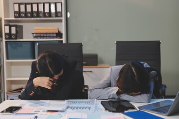 Asian women are stressed while working on laptop, Tired asian businesswoman with headache at...