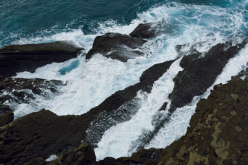 Dynamic Waves Crashing on Rugged Coastal Rocks